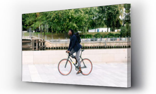 Wizualizacja Obrazu : #473658532 A beautiful black man riding his bike