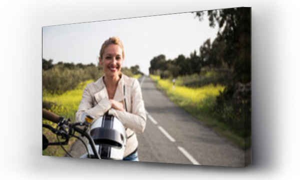 Wizualizacja Obrazu : #474002641 Smiling female biker sitting with helmet on motorcycle