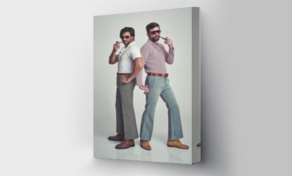 Wizualizacja Obrazu : #481707634 We know were groovy. Studio shot of two men standing together while wearing retro 70s wear and striking a pose.