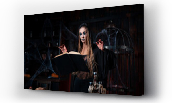 Wizualizacja Obrazu : #484585439 Halloween concept. Witch dressed black hood with dreadlocks standing dark dungeon room use magic book for conjuring magic spell