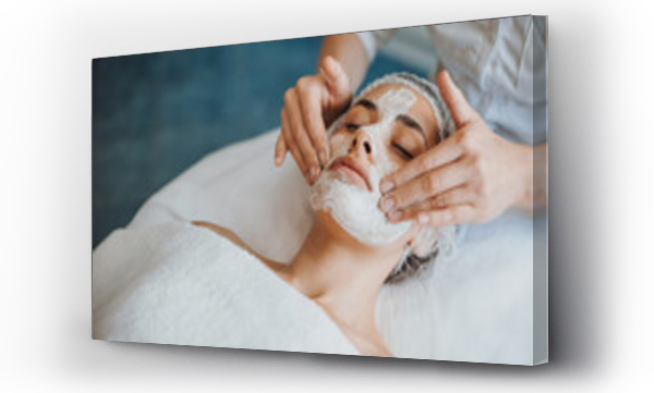 Wizualizacja Obrazu : #492699325 Close-up portrait of anorganic facial mask application at spa salon. Facial treatment. Skin care. Health care. Rejuvenation treatment.