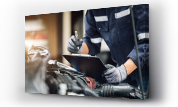 Wizualizacja Obrazu : #495030214 Mechanic works on the engine of the car in the garage. Repair service. Concept of car inspection service and car repair service.