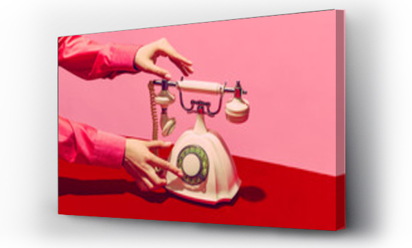 Wizualizacja Obrazu : #496832585 Pop art photography. Retro objects, gadgets. Female hand holding handset of vintage phone isolated on pink and red background. Vintage, retro fashion style