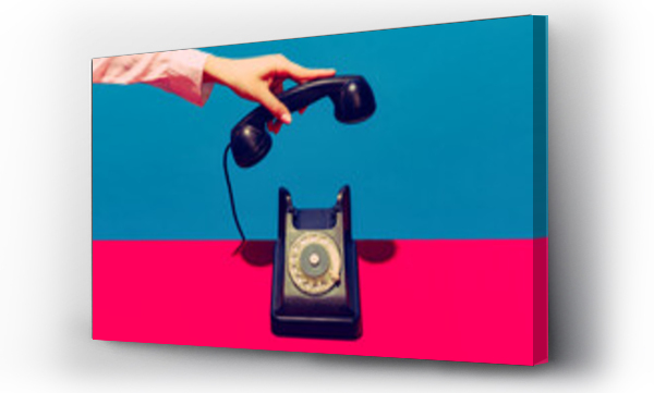 Wizualizacja Obrazu : #496837258 Retro objects, gadgets. Female hand holding handset of vintage phone isolated on blue and pink background. Vintage, retro fashion style. Pop art photography.