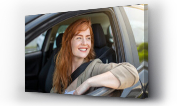 Wizualizacja Obrazu : #503988720 Beautiful young woman driving her new car at sunset. Woman in car. Close up portrait of pleasant looking female with glad positive expression, woman in casual wear driving a car