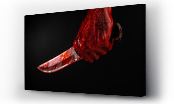 Wizualizacja Obrazu : #507709652 A man with bloody hands brandishes a knife on a black background. 