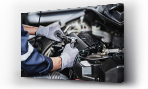 Wizualizacja Obrazu : #507812981 Professional mechanic working on the engine of the car in the garage. Car repair service.