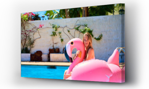 Wizualizacja Obrazu : #510157591 Young woman on flamingo float
