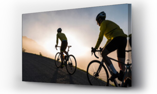Wizualizacja Obrazu : #518456646 Man and woman cycling together on misty morning