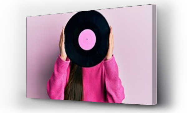 Wizualizacja Obrazu : #520443490 Woman holding retro vinyl disc covering face over pink background