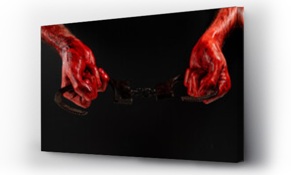 Wizualizacja Obrazu : #523948285 A man with bloody hands holds iron handcuffs.