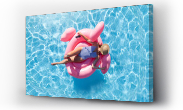 Wizualizacja Obrazu : #525494529 Woman relaxing on pink flamingo inflatable ring