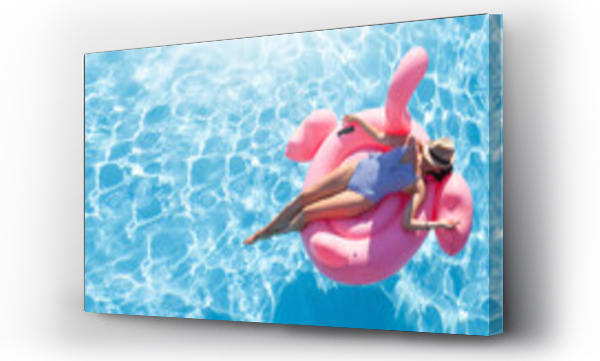 Wizualizacja Obrazu : #526672809 Woman relaxing on pink flamingo inflatable ring