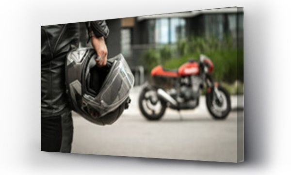 Wizualizacja Obrazu : #529691843 Biker walks to motorcycle holding helmet in hand