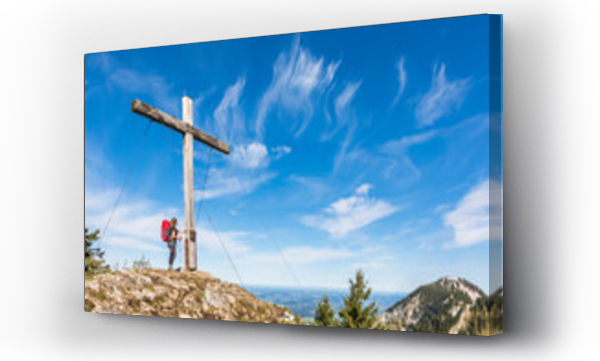Wizualizacja Obrazu : #551483250 Germany, Bavaria, Female hiker standing in front of summit cross of Karkopf mountain