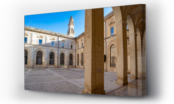 Wizualizacja Obrazu : #556764303 Piazza del Duomo with the Lecce Cathedral bell tower and surrounding buildings with a portico in the Historic Center of Lecce; Lecce, Puglia, Italy