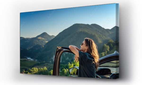 Wizualizacja Obrazu : #563859074 Young beautiful woman traveling by car in the mountains, summer vacation