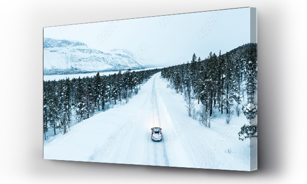 Wizualizacja Obrazu : #569614939 Overhead car-view driving on icy road crossing a forest covered with snow, Stora Sjofallet, Norrbotten County, Lapland, Sweden, Scandinavia, Europe