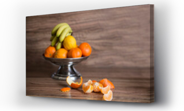Wizualizacja Obrazu : #569823025 Close-up of fruit bowl of orange and banana on table, Munich, Bavaria, Germany