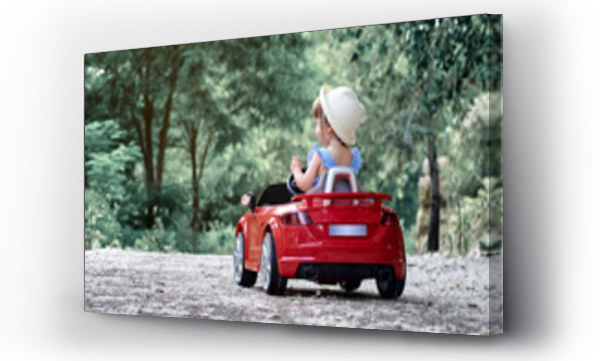 Wizualizacja Obrazu : #570530079 A girl riding a toy car