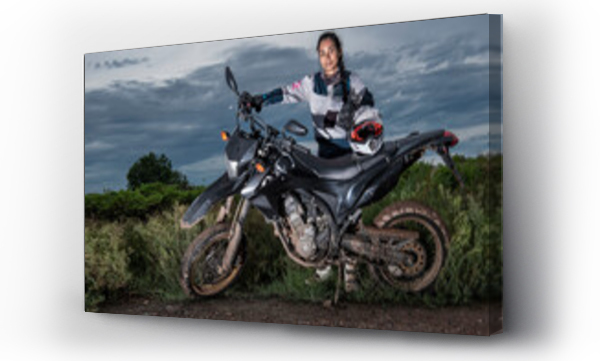 Wizualizacja Obrazu : #570824030 Woman posing behind her super moto style motorcycle on dirt road