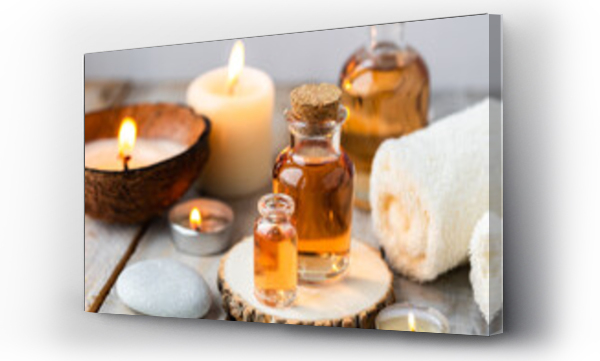 Wizualizacja Obrazu : #576467203 Concept of spa treatment in salon with pure organic natural oil. Atmosphere of relax, detention. Aromatherapy, candles, towel, wooden background. Skin care, body gentle treatment