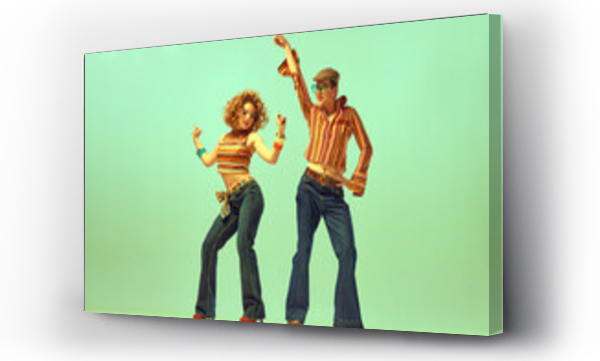 Wizualizacja Obrazu : #579350423 Two excited people, man and woman in retro style clothes dancing disco dance over green background. 1970s, 1980s fashion, music, hippie lifestyle,