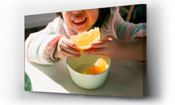 Wizualizacja Obrazu : #584970252 Little Asian girl eating fruit