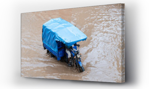 Wizualizacja Obrazu : #593769122 motorcycle passing through flooded road in africa