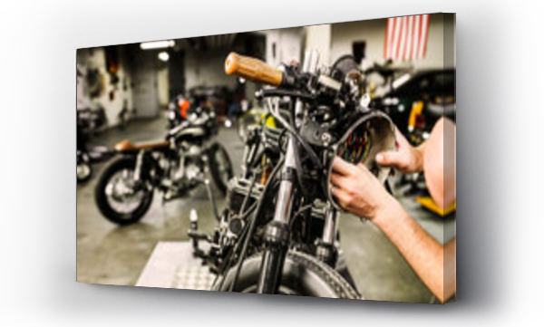 Wizualizacja Obrazu : #599305012 Man repairing motorcycle headlight in workshop