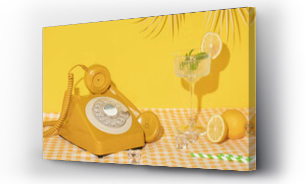 Wizualizacja Obrazu : #617266243 Summer creative layout with cocktail glass, lemons, drinking straws, ice cubes and yellow retro telephone with palm leaf on bright yellow and plaid background. 80s or 90s retro aesthetic 