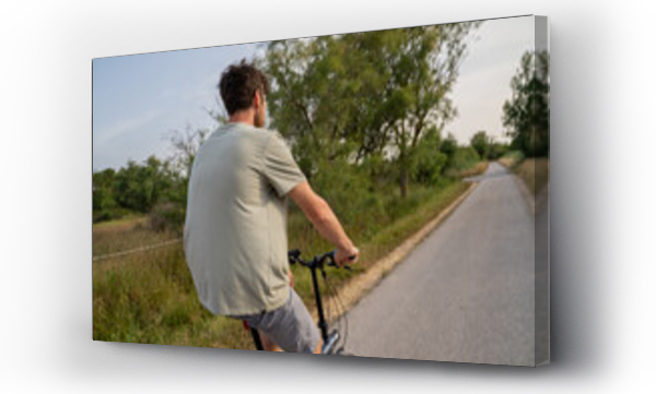 Wizualizacja Obrazu : #620652262 Man going for a bike stroll  in nature