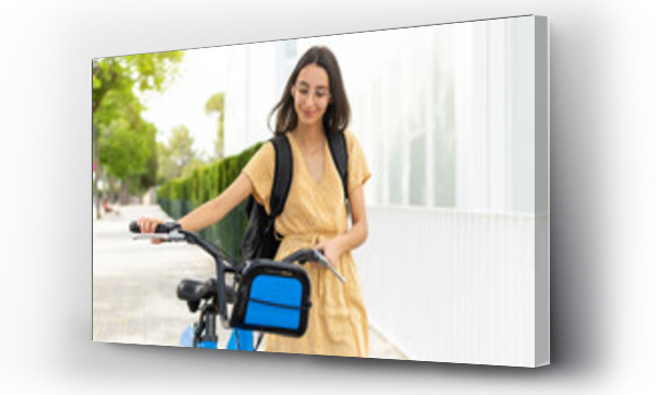 Wizualizacja Obrazu : #633063091 Cheerful woman with bicycle on street in city