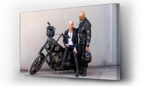 Wizualizacja Obrazu : #637891554 Cool mature biker couple in leather clothes posing with motorcycle