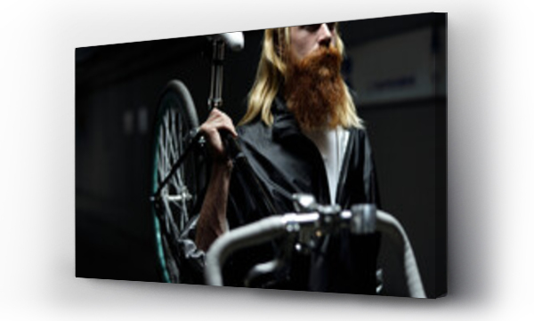 Wizualizacja Obrazu : #641500386 Middle-aged man with long blond hair and full ginger beard walking down the street at night and carrying bike with one hand   