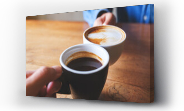 Wizualizacja Obrazu : #641635217 Closeup image of a couple people clinking coffee cups together in cafe