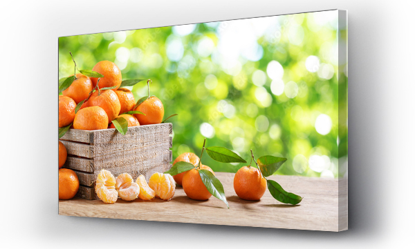 Wizualizacja Obrazu : #643505815 Fresh mandarin oranges fruit or tangerines with leaves in a wooden box