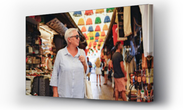 Wizualizacja Obrazu : #645983379 Senior woman tourist on a Turkish market
