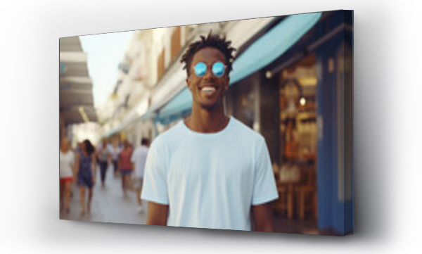 Wizualizacja Obrazu : #650657679 Portrait of young fashion smiling African American man with white T-shirt, Plaza shopping district background.