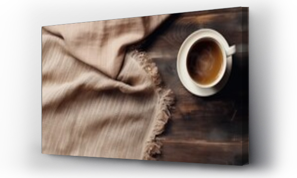 Wizualizacja Obrazu : #651359438 A cup of hot coffee on an old wooden table, seen from above with empty space as a background for words or promotional items. Perfect for winter themed designs, coffee shops and relaxation designs.