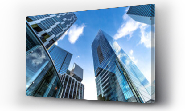 Wizualizacja Obrazu : #651488097 Low angle of modern highrise building with reflection glass in the city wth blue sky