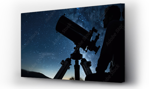 Wizualizacja Obrazu : #653898369 Male astronomer looks at the night sky through a telescope