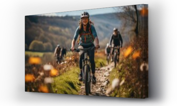 Wizualizacja Obrazu : #655531579 young woman mountain biking in the mountains on an autumn day