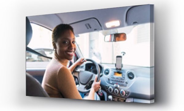 Wizualizacja Obrazu : #656967341 Smiling young woman holding steering wheel in car