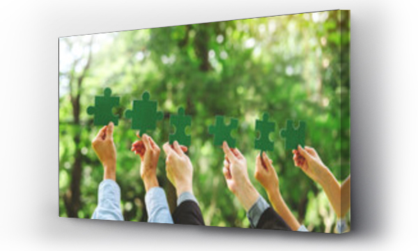 Wizualizacja Obrazu : #662130283 World environment day  and ESG Concept of teamwork and partnership Hands join Jigsaw puzzle pieces with global community sustainable Save Earth. the Environment World Earth Day concept