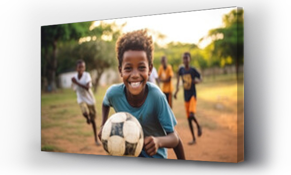 Wizualizacja Obrazu : #663444440 Little African boy is playing football with happy friends in village.