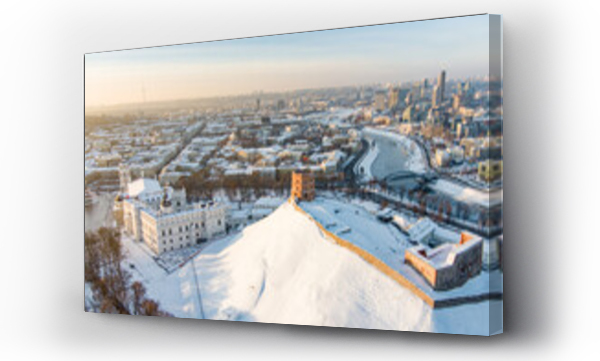 Wizualizacja Obrazu : #664694866 Beautiful sunny Vilnius city scene in winter. Aerial early evening view. Winter city scenery in Lithuania.