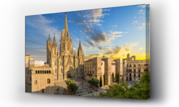 Wizualizacja Obrazu : #669308385 View of the Gothic Barcelona Cathedral of the Holy Cross and Saint Eulalia with surround buildings, plaza and the skyline of Barcelona in view as the sun sets at dusk.