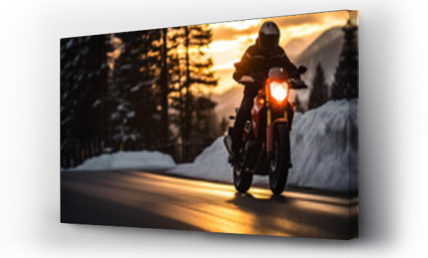 Wizualizacja Obrazu : #669654316 Motorcycle rider on a snowy road in winter  in the mountains at sunset.
