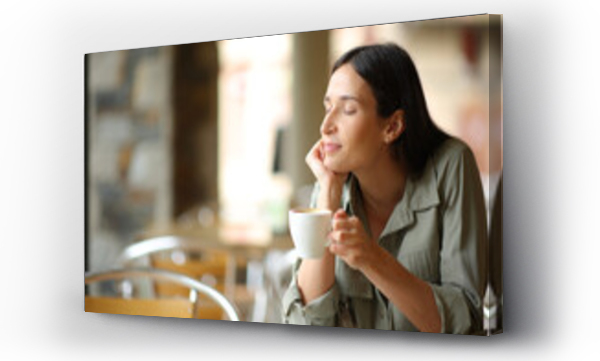 Wizualizacja Obrazu : #669878401 Woman relaxing drinking coffee in a terrace